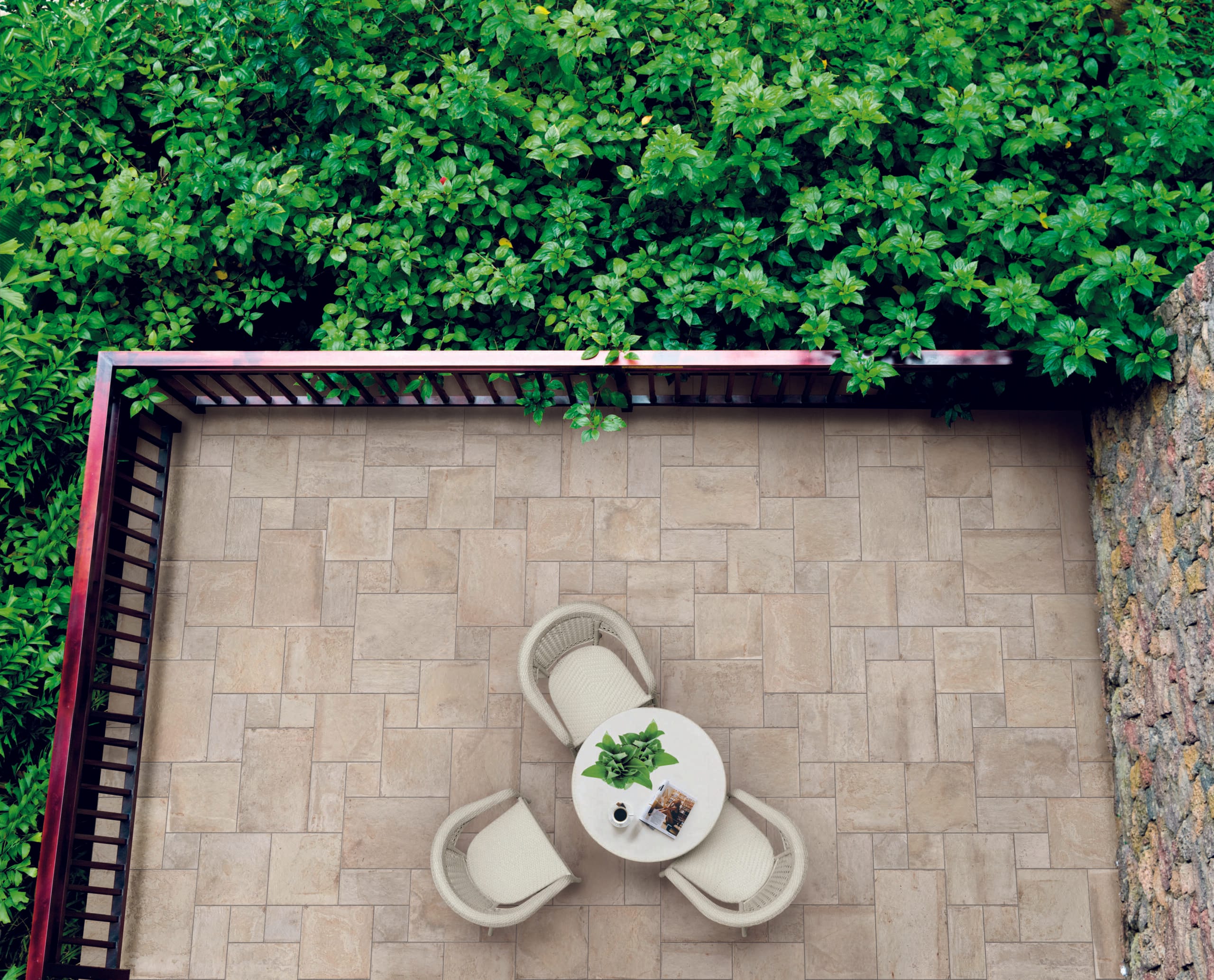High angle view of two chairs in a balcony garden.